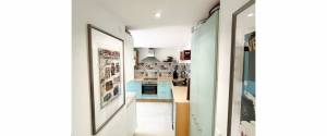 ERDGESCHOSS-WOHNUNG MIT TERRASSE, GARTEN UND PARKPLATZ