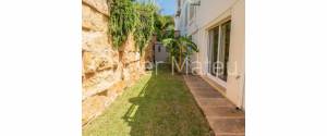 PLANTA BAJA JUNTO A LA PLAYA CON PISCINA COMUNITARIA Y JARDÍN PROPIO EN PORTO COLOM