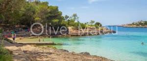 PLANTA BAJA JUNTO A LA PLAYA CON PISCINA COMUNITARIA Y JARDÍN PROPIO EN PORTO COLOM